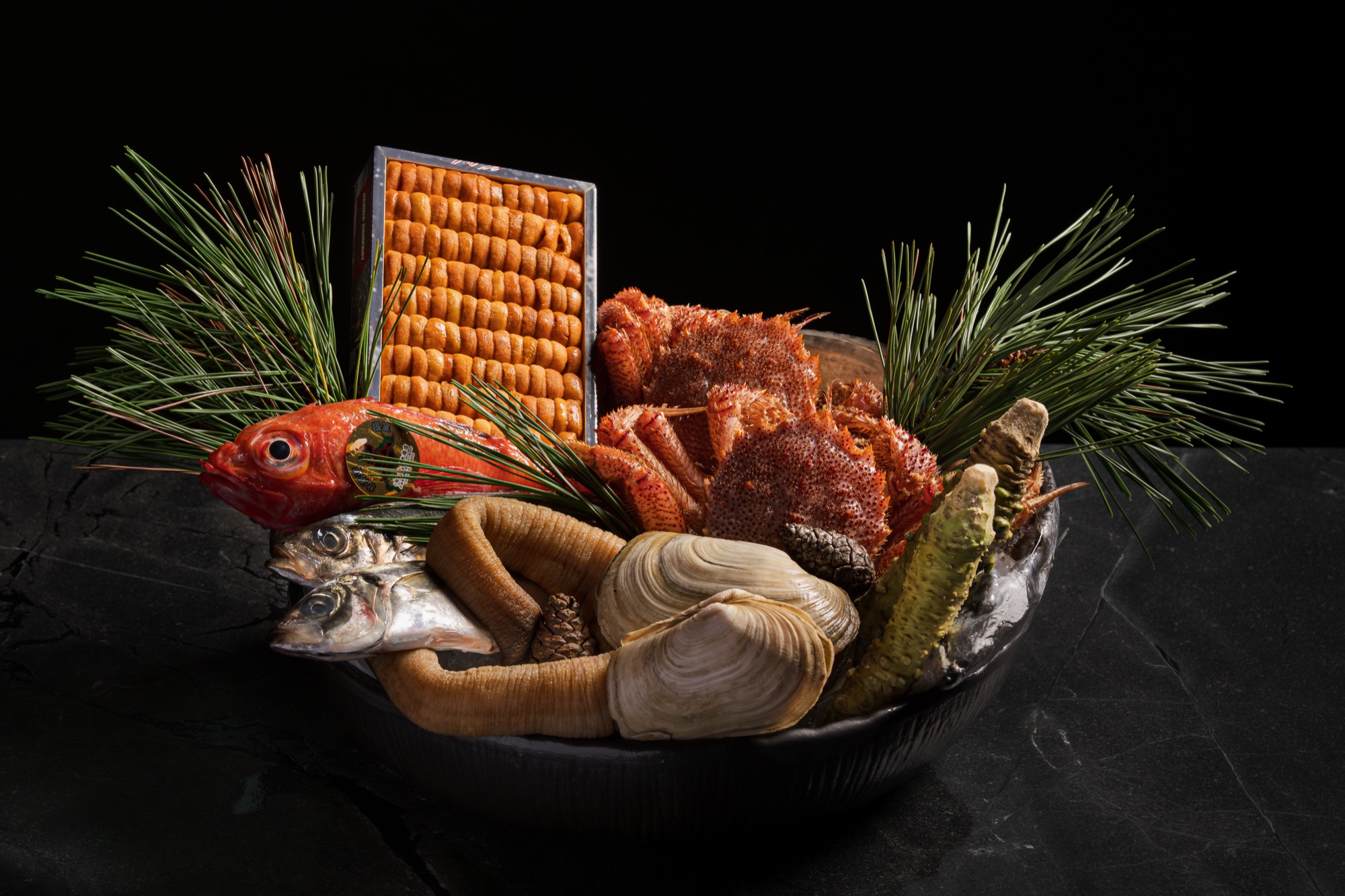 The Toyosu Market selection: a box of uni, hairy crab, geoduck, kinmedai and fresh wasabi among pine