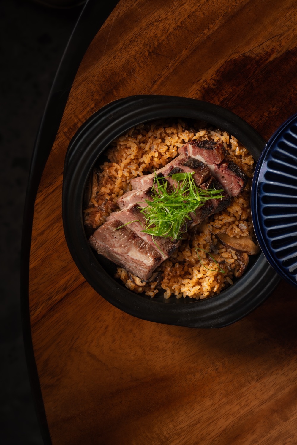 Clay Pot with sliced gyu over crisp rice and mushrooms, for the table to share